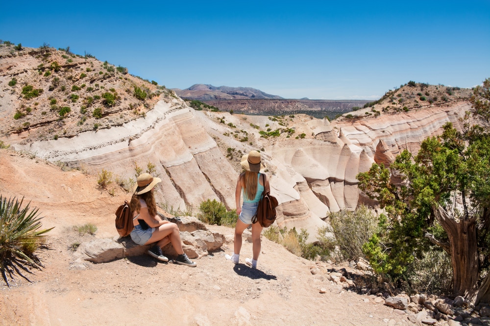 Two women Hiking at Tent Rocks - one of the best things to do in New Mexico in 2023